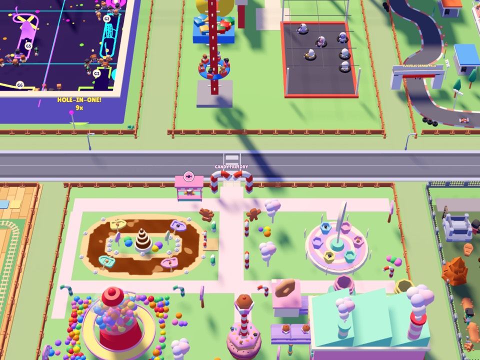 The Candy Factory from above, across the street from Glow Putt and the Fun Yard: a chocolate river with boats, a giant gumball machine, a cupcake tower and a lollipop ride